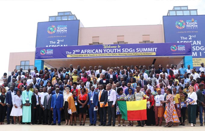 A group photo of the opening panel and conference attendees at the Accra International Conference Centre