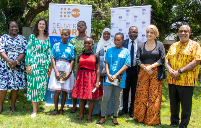 The Ambassadors and mentors in a group photograph with the adolescent girls.