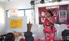 A resource person teaching the participants about menstruation
