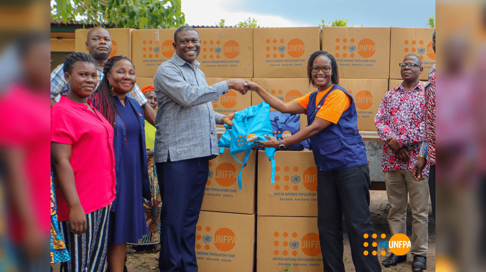 Handing over of the dignity kits on behalf of UNFPA by the Deputy Country Representative, Emmily Naphambo, Ph.D