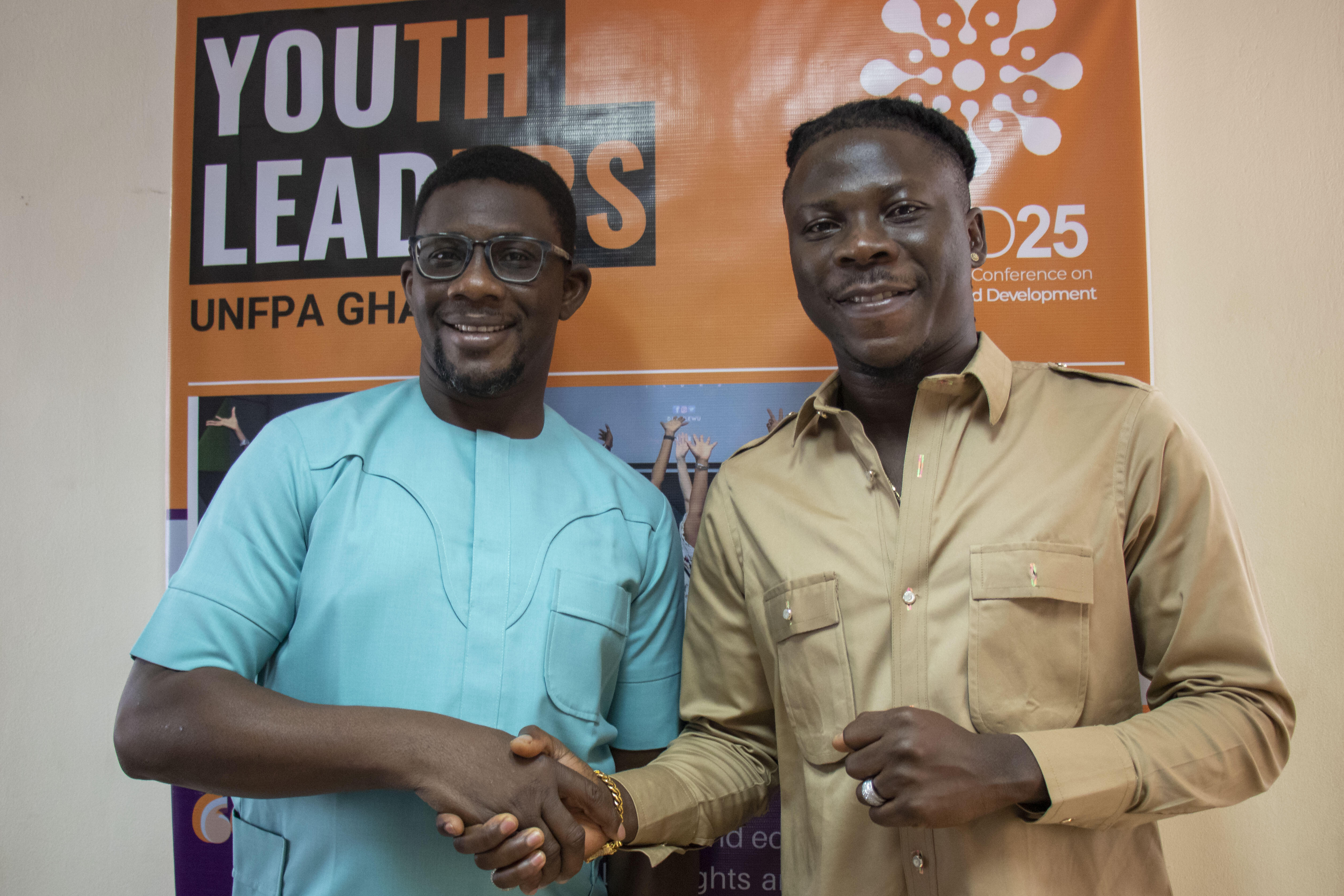 Stonebwoy and UNFPA Representative Niyi Ojuolape.   
