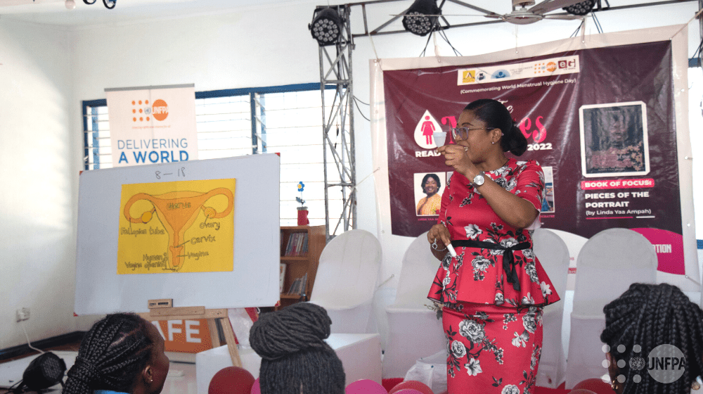 A resource person teaching the participants about menstruation